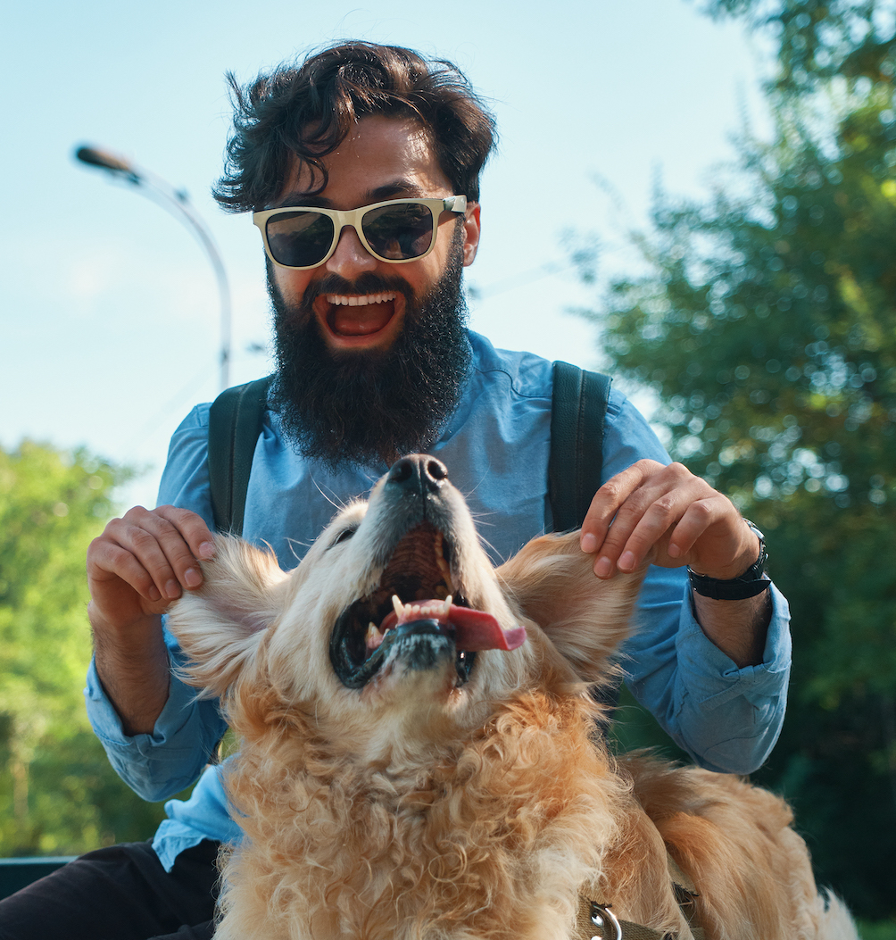 man and dog having fun, playing, making funny faces